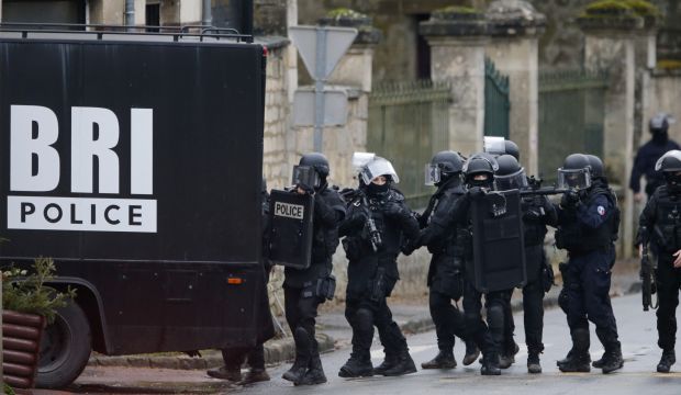French special intervention police conduct a house-to-house search in Longpont, northeast of Paris, on January 8, 2015. (Reuters/Pascal Rossignol)