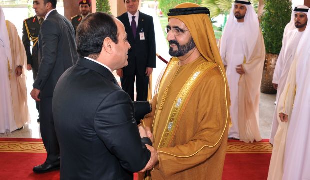 Sheikh Mohammed Bin Rashid Al Maktoum, Vice-President and Prime Minister of the UAE (R), shakes hands with Egyptian President Abdel-Fattah El-Sisi (L), at the Al-Mushrif Palace, Abu Dhabi, on January 18, 2015. (EPA/Office of Egyptian Presidency/HO)
