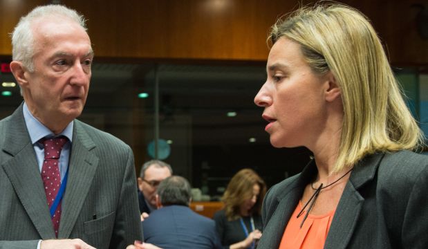 EU counter-terrorism chief Gilles de Kerchove (L) speaks with EU foreign policy chief Federica Mogherini (R) before the start of a EU Foreign Affairs Council meeting at EU headquarters in Brussels, on January 19, 2015 (AFP PHOTO / EMMANUEL DUNAND)