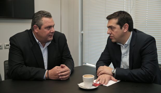 Head of radical leftist Syriza party Alexis Tsipras (R) meets with leader of right-wing, anti-bailout Independent Greeks party Panos Kammenos at party headquarters in Athens, January 26, 2015. (REUTERS/Lefteris Pitarakis/Pool)