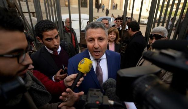 Defense lawyer of Al-Jazeera English journalist Egyptian–Canadian Mohamed Fahmy, Nejad Al-Borai, speaks to the press outside the high court in downtown Cairo on January 1, 2015. (AFP Photo/Khaled Desouki)