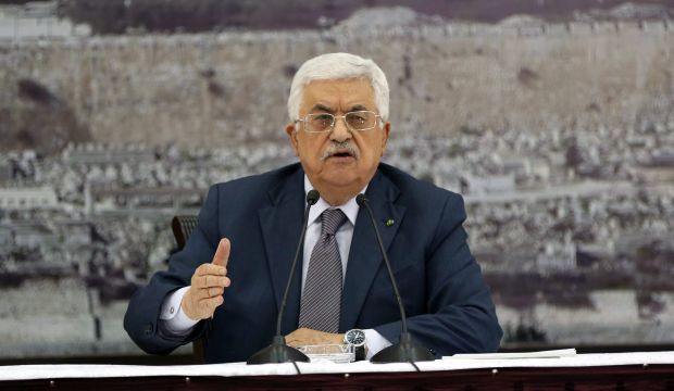 Palestinian President Mahmoud Abbas during a meeting to sign more than 20 international treaties, including the Rome Statute of the International Criminal Court, in the West Bank city of Ramallah, on December 31, 2014. (EPA)