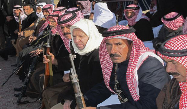 Sunni volunteers carry weapons during a parade as they prepare to fight against Islamic State of Iraq and Syria (ISIS) militants, in the town of Amiriyah Fallujah in Anbar province, on January 8, 2015. (Reuters)