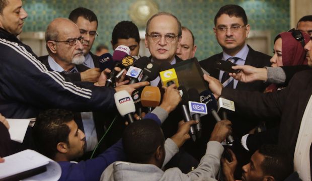 Hadi Al-Bahra, the head of the Syrian National Coalition, speaks during a press conference following his meeting with Arab League Secretary-General Nabil Elaraby at the League's headquarters in Cairo, Egypt, on December 27, 2014. (AP Photo/Amr Nabil)