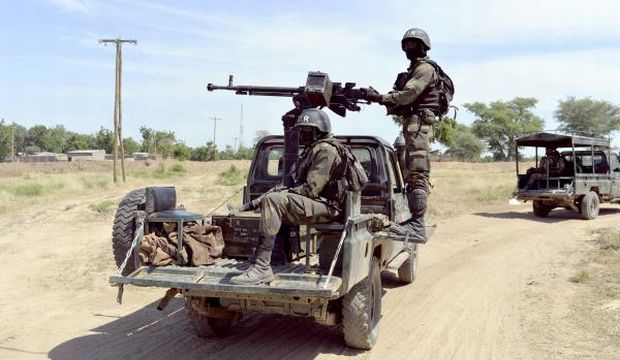 Cameroonian soldiers patrolling in Amchide, northern Cameroon, 1 km from Nigeria. Around 20 of the dozens of hostages seized by Boko Haram in Cameroon at the weekend were released by the Islamists as they were chased by the army, media reports and sources said on January 19, 2015. (AFP)