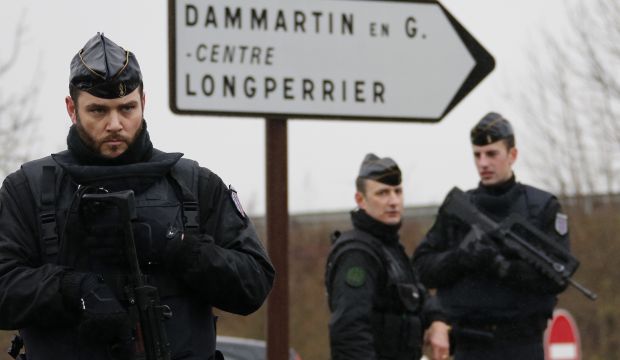 French gendarmes secure the roundabout near the scene of a police lock-down around an industrial zone where the Charlie Hebdo suspects are holding one person hostage in Dammartin-en-Goele, northeast of Paris on January 9, 2015. (Reuters/Eric Gaillard)