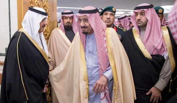 King Salman (C) and Prince Miteb, son of late Saudi King Abdullah (L) receive dignitaries in Riyadh, Saudi Arabia. (AP Photo/SPA)