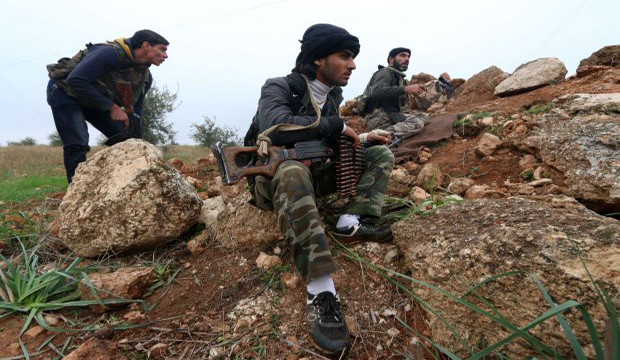 Fighters from the Al-Nusra Front, Al-Qaeda's Syria branch, hold a position as they fight against forces loyal to the regime on December 19, 2014 in the southern countryside of Syria's northern city of Aleppo. (AFP Photo/Fadi Al-Halabi)
