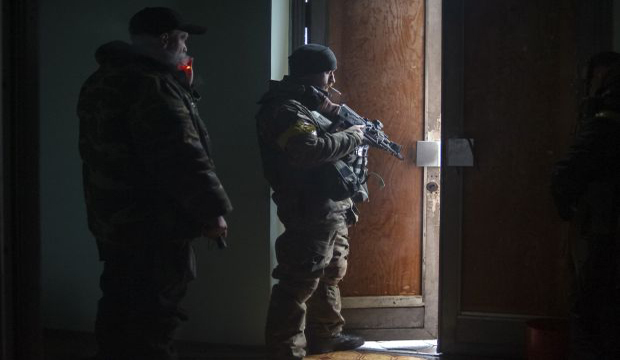 Members of the Ukrainian armed forces gather inside a school building in Debaltseve, Donetsk region, January 30, 2015. (Reuters/Maksim Levin)