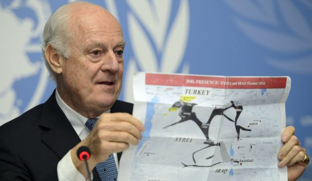 The UN Special Envoy for Syria Staffan de Mistura shows a map during a press conference on Syria at the European headquarters of the United Nations, in Geneva, Switzerland, on January 15, 2015. (AP Photo/Keystone, Martial Trezzini)