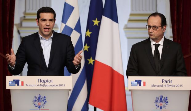 French President Francois Hollande (R) and Greek Prime Minister Alexis Tsipras (L) attend a joint statement after a meeting at the Elysee Palace in Paris, on February 4, 2015. (REUTERS/Philippe Wojazer)