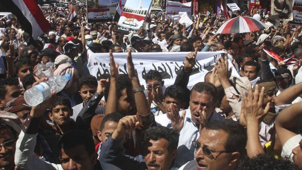 People demonstrate against the dissolution of Yemen's parliament and the takeover by the armed Shi'ite Muslim Houthi group, in the southwestern city of Taiz. (Reuters Photos.)