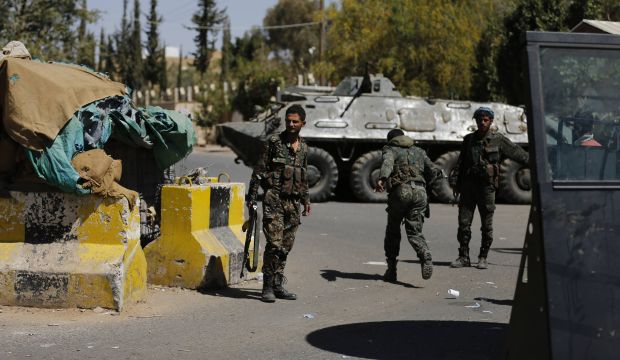 Yemeni security forces secure the entrance of the US embassy in Sana'a, Yemen, on February 11, 2015. (Reuters/Khaled Abdullah)