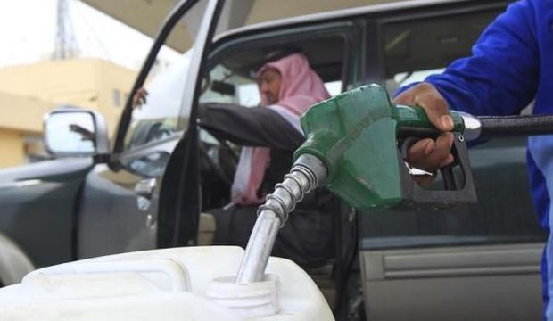 In this December 19, 2012 file photo, an employee fills a container with diesel at a gas station in Riyadh, Saudi Arabia. (Reuters/Fahad Shadeed)