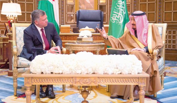 Saudi King Salman Bin Abdulaziz (left) talks to King of Jordan Abdullah II in Riyadh on 26 February, 2015. (SPA) 