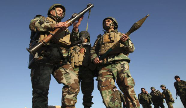 Kurdish Peshmerga fighters inspect a rocket-propelled grenade (RPG) launcher as they take control of the area, on the outskirts of Mosul, Iraq, on February 6, 2015. (Reuters/Ari Jalal)