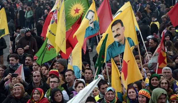 Members of the Kurdish community wave flags and banners of convicted Kurdistan Worker's Party (PKK) leader Abdullah Ocalan during a demonstration calling for his release in Strasbourg, France, on February 14, 2015. (AFP Photo/Frederick Florin)