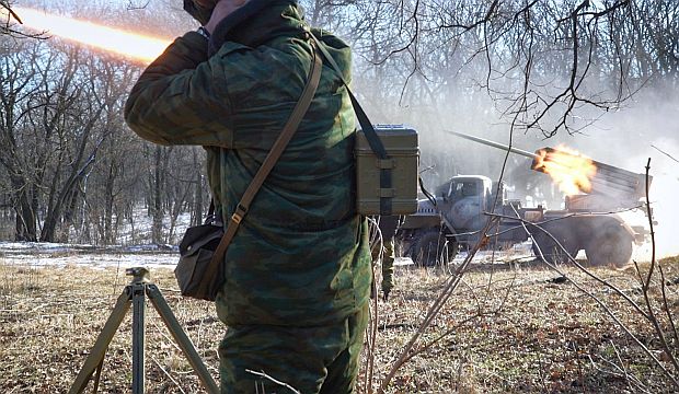 Pro-Russian rebels stationed in Donetsk region launch missiles toward a position of the Ukrainian forces in Debaltseve, about 20 miles away, on February 13, 2015. (AFP Photo/Andrey Borodulin)