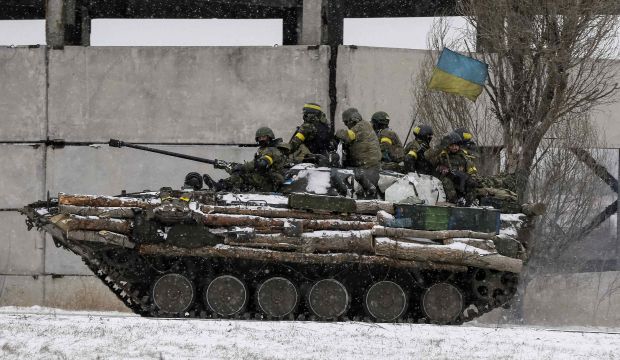 Members of the Ukrainian armed forces ride on a military vehicle near Debaltseve, eastern Ukraine, on February 16, 2015. (Reuters/Gleb Garanich)