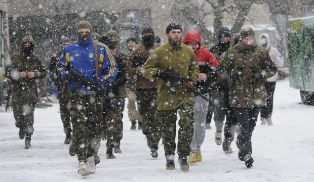 Servicemen of Ukrainian volunteers battalion 'Azov' train at a base in Mariupol, Ukraine, on February 9, 2015. (EPA/Ivan Boberskyy)