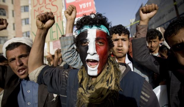 A Houthi rebel with Yemen's flag painted on his face chants slogans during a rally to show support for the Houthis in Sana'a, Yemen, on February 27, 2015. (AP Photo/Hani Mohammed)