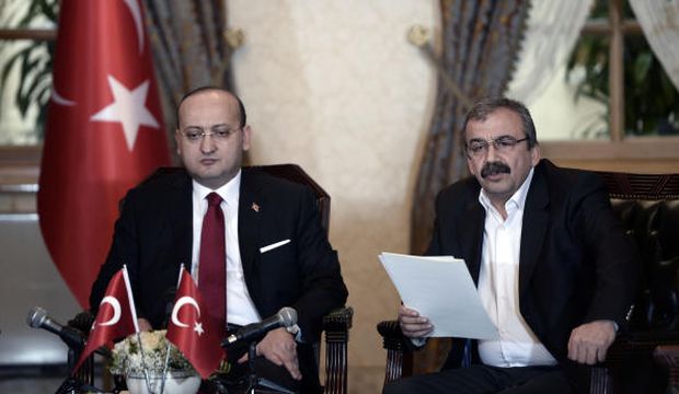 In this photo provided by the Turkish prime minister's press office, Pro-Kurdish legislator Sırrı Süreyya Önder (R) and Turkish Deputy Prime Minister Yalçın Akdoğan speak after a meeting in Istanbul, Turkey, on February 28, 2015. (AP Photo/Prime Minister's Press Office)