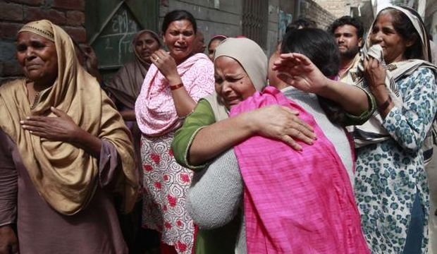 Women mourn the death of their relative who was killed in a suicide attack on a church in Lahore, Pakistan, on March 15, 2015. (Reuters/Mohsin Raza)