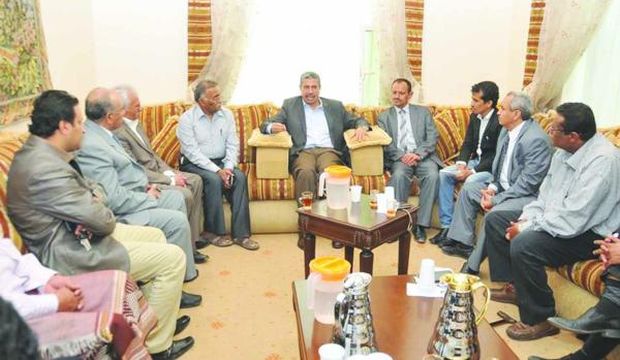 Yemeni Prime Minister Khaled Bahah sits with his aides at his residence in Yemeni capital Sana'a, on March 15, 2015. (Asharq Al-Awsat)
