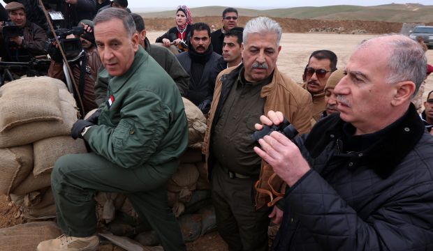 Iraqi Vice-President Osama Al-Nujaifi (R), Athil Al-Nujaifi, the governor of Mosul (C) and Iraqi Defense Minister Khalid Al-Obaidi visit a Kurdish Peshmerga position on the frontline in the Gwer, Iraq, on January 9, 2015. (AFP Photo/Safin Hamed)