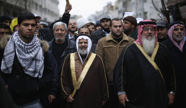 Leader of Jordan's Muslim Brotherhood Sheikh Hammam Said (C), takes part during a protest against satirical French weekly newspaper 'Charlie Hebdo' after the Friday prayer in Amman. Jordan, on January 16, 2015. (Reuters/Muhammad Hamed)