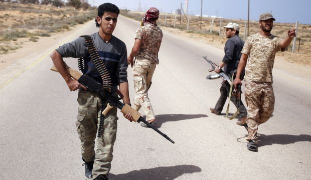 Libyan Dawn fighters search for ISIS militant positions during a patrol near Sirte on March 17, 2015. (Reuters/Goran Tomasevic)