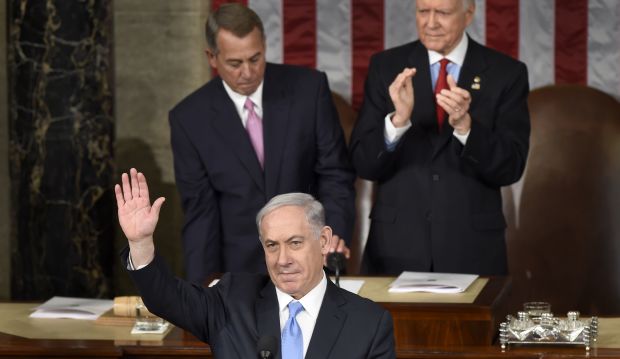 Israeli Prime Minister Benjamin Netanyahu waves as he speaks before a joint meeting of Congress on Capitol Hill in Washington, on March 3, 2015. (AP Photo/Susan Walsh)