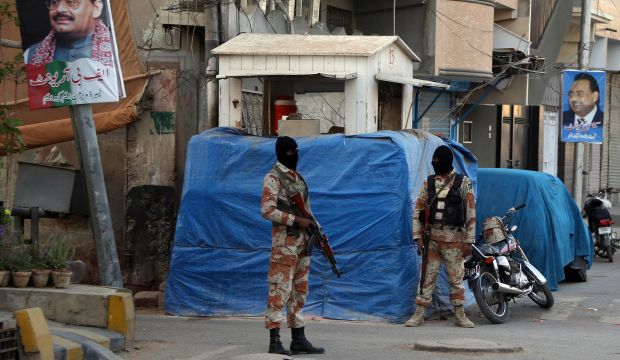Pakistani Rangers take position during a raid at the headquarters of the Mutahida Qaumi Movement (MQM), in Karachi, Pakistan, on March 11, 2015. (EPA/Rehan Khan)