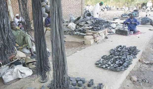 Mohamed Abkar's workshop transforms tires into shoes in Khartoum. (Asharq Al-Awsat)