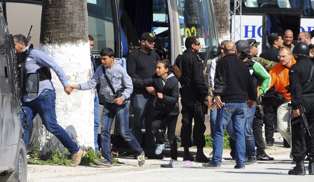Visitors at the Bardo museum are evacuated in Tunis, on March 18, 2015. (AP Photo/Hassene Dridi)