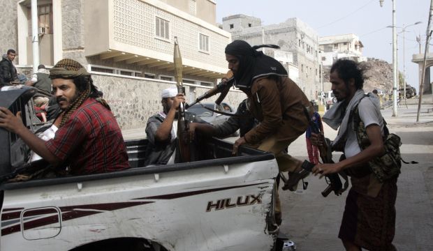 Militiamen loyal to Yemen's President Abd Rabbuh Mansur Hadi ride a vehicle outside the Republican Palace in Aden, Yemen, on February 25, 2015. (Reuters/Yaser Hasan)