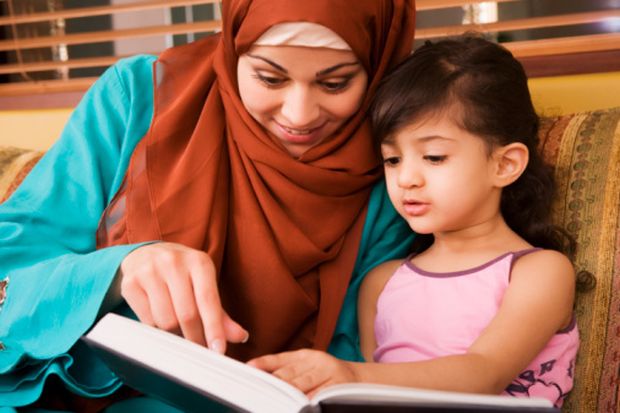 A Saudi mother teaches her daughter at home. (Getty Images/ArabianEye)