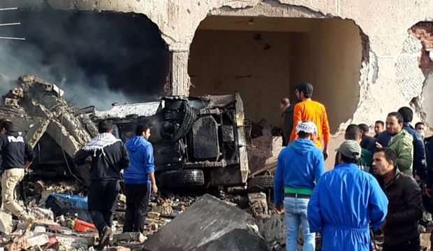 Egyptians gather at the scene following a bombing that struck a main police station in El-Arish, the capital of the North Sinai province, on April 12, 2015. (AP Photo/Muhamed Sabry)
