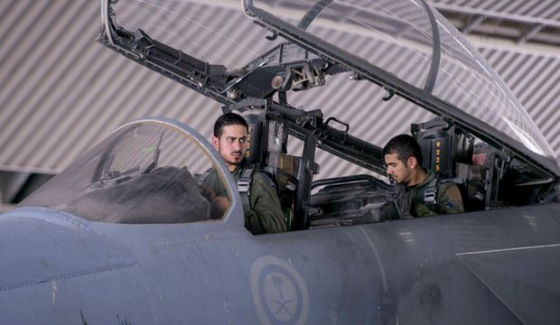 In this file photo released Sept. 24, 2014 by the official Saudi Press Agency, Saudi pilots sits in the cockpit of a fighter jet as part of U.S.-led coalition airstrikes on Islamic State militants and other targets in Syria, in Saudi Arabia. (AP Photo/Saudi Press Agency, File)