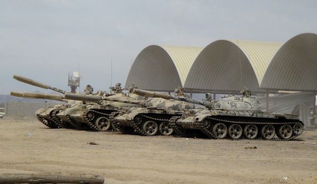 In this photo taken Tuesday, March 24, 2015, tanks seized recently by militiamen loyal to Yemen's President Abed Rabbo Mansour Hadi take positions at the al-Anad air base in the southern province of Lahej, 60 kilometers (35 miles) north of Aden, Yemen. (AP Photo/Wael Qubady)