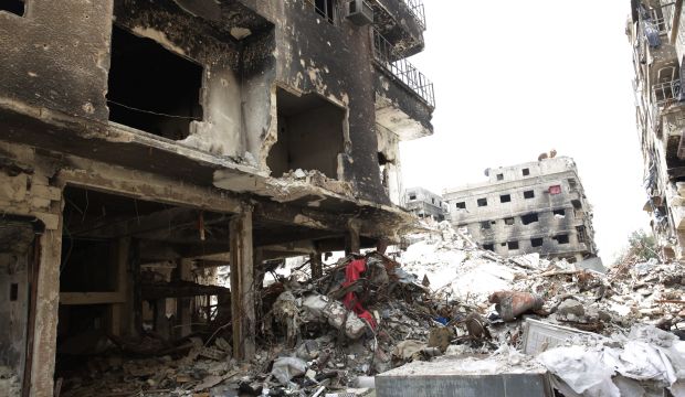 Rubble and heavy damage remain on a deserted street during a government escorted visit to Yarmouk refugee camp in Damascus, Syria, on April 9, 2015. (AP Photo)