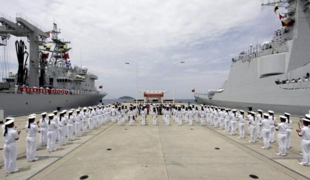 Chinese navy sailors stand in formation as they attend a send-off ceremony before departing for the Rim of the Pacific exercise (RIMPAC), at a military port in Sanya, Hainan province, China, on June 9, 2014. (Reuters/Stringer)