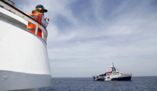 Migrant Offshore Aid Station (MOAS) founder Regina Catrambone of Italy watches as the MOAS ship MV Phoenix sails outside Valletta's Grand Harbor, in Malta, on May 2, 2015. (Reuters/Darrin Zammit Lupi)