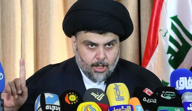 Iraqi Shi’ite cleric Moqtada al-Sadr delivers a speech from the southern Iraqi city of Najaf on February 18, 2014. (AFP Photo/Haidar Hamdani)