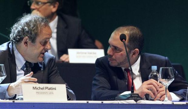 UEFA President Michel Platini (L) speaks with then-FIFA Vice President for Asia Prince Ali Bin Al-Hussein of Jordan during the South American Football Confederation (CONMEBOL) ordinary congress in Luque, Paraguay, on March 4, 2015. (Reuters/Jorge Adorno)