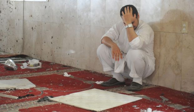 A family member of a slain victim mourns after arriving at the Ali Ibn Abu Talib Mosque, the site of a suicide bomb attack, in the village of Al-Qadeeh in the eastern province of Qatif, Saudi Arabia, on May 22, 2015. (Reuters)