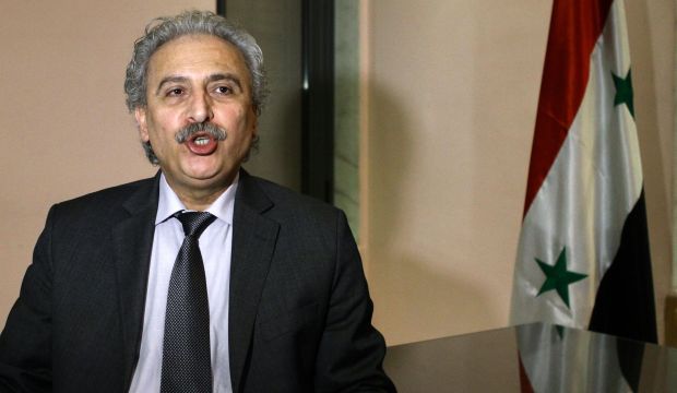 Louay Hussein, a leading Syrian intellectual and president and co-founder of the Syrian opposition movement Building the Syrian State (BSS) speaks during an interview in Damascus on March 3, 2015. (AFP/Louai Beshara)