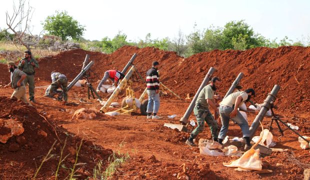 Rebel fighters prepare mortars at the frontline where they announced the start of an offensive to take control of Ariha town from forces loyal to Syria's President Bashar Al-Assad, in Idlib province on May 12, 2015. (Reuters/Ammar Abdullah)