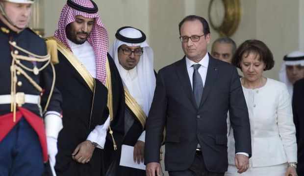 French President François Hollande (2nd-R) accompanies Saudi Deputy Crown Prince and Defense Minister Prince Mohammed Bin Salman (L) as he leaves the Élysée Palace, in Paris, on June 24, 2015. (AFP Photo/Alain Jocard)