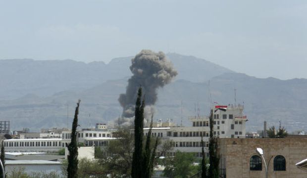 Smoke rises after Saudi-led airstrikes hit a site believed to be one of the largest weapons depots on the outskirts of Yemen's capital, Sanaa, on June 3, 2015. (AP Photo/Hani Mohammed)